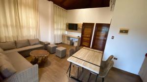 a living room with a couch and a table at Tantiri River Resort in Puerto Maldonado