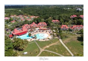 an aerial view of a resort with a swimming pool at TI KAZ DOUDOU - village de vacances bord de mer in Sainte-Anne