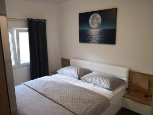 Posteľ alebo postele v izbe v ubytovaní Apartment Tomi