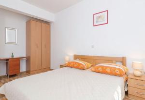 Postel nebo postele na pokoji v ubytování Apartments Ljuba