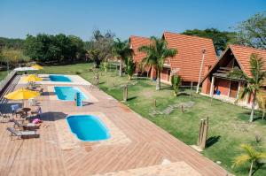 an overhead view of a resort with three pools at Pousada Bela Vista in Sengés