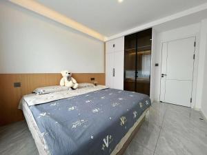 Ένα ή περισσότερα κρεβάτια σε δωμάτιο στο Nuanwo Inn