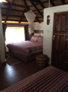 a bedroom with a bed in a room at Tabonina Guesthouse in Livingstone +80 photos