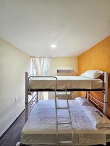Postel nebo postele na pokoji v ubytování Sensity Home Departamento 7, Colorido y amplio Familiar