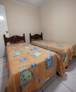 Giường trong phòng chung tại Casa de praia para temporada espaço inteiro Putiri ES