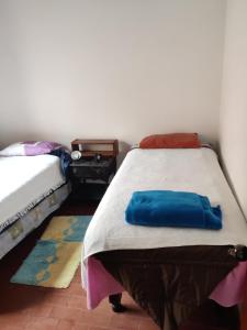 a bedroom with two twin beds in a room at bungalows in Santa Rosa +18 photos