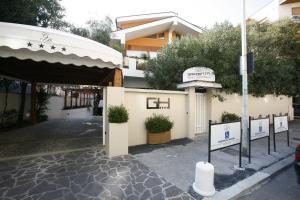a building with a sign in front of it at Villa Alba Boutique Hotel in Pescara