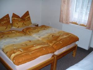 Postel nebo postele na pokoji v ubytování Pension Jitka