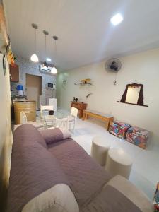 a living room with a couch and a table at Hostel Tupi in Manaus