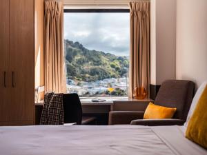 a hotel room with a bed and a window at WQ Wellington Quarter Hotel in Wellington +32 photos