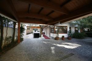 an empty courtyard of a building with trees and plants at Villa Alba Boutique Hotel in Pescara