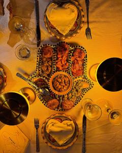 a table with plates of food on top of it at Riad Chay & Boutique in Ouarzazate