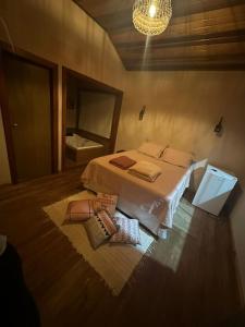 Postel nebo postele na pokoji v ubytování Pousada Camping e Restaurante Vila dos Arcanjos