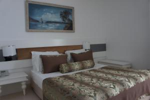 Postel nebo postele na pokoji v ubytování Onkel Resort Hotel