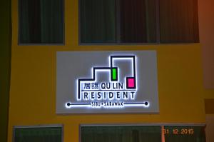 a sign on the side of a building at Qu Lin Resident in Sibu