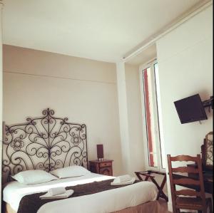 Postel nebo postele na pokoji v ubytování Hotel Danemark
