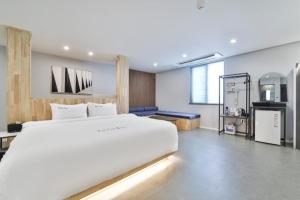 Ένα ή περισσότερα κρεβάτια σε δωμάτιο στο Cheongju The City Hotel