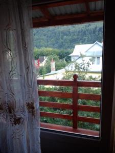 a window with a view of a fence at U Karoliny in Yaremche