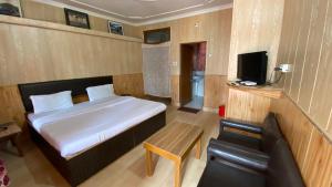 Postel nebo postele na pokoji v ubytování Hotel Ekant Lodge + 4 fotografie