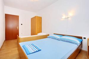 Posteľ alebo postele v izbe v ubytovaní Apartment Elena