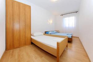 Posteľ alebo postele v izbe v ubytovaní Apartment Elena