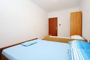 Posteľ alebo postele v izbe v ubytovaní Apartment Elena
