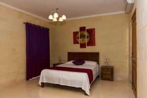 Postel nebo postele na pokoji v ubytování GozoPride Penthouse + 7 fotografií