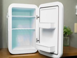 a white refrigerator sitting on top of a table at IKIDANE Cozy Hotel Haneda Airport - Vacation STAY 25834v in Tokyo