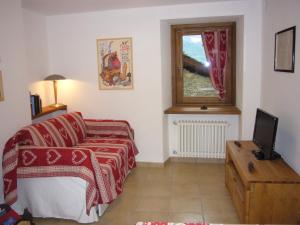 A bed or beds in a room at Le Chaton Fait Ronron