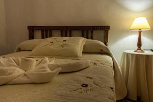 Postel nebo postele na pokoji v ubytování Apartamentos Rurales La Casa de Luis