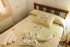 Postel nebo postele na pokoji v ubytování Apartamentos Rurales La Casa de Luis