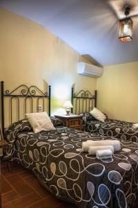 Postel nebo postele na pokoji v ubytování Apartamentos Rurales La Casa de Luis