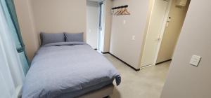 Postel nebo postele na pokoji v ubytování KIYAZA Resort 沖縄 KUME