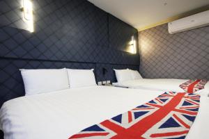 Postel nebo postele na pokoji v ubytování I Hi Loveriver Hotel