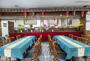 Zhangjiajie Huan Sha Ju Hotel餐厅或其他用餐的地方