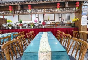 Zhangjiajie Huan Sha Ju Hotel餐厅或其他用餐的地方