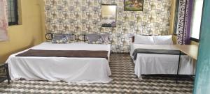 Postel nebo postele na pokoji v ubytování Aguiar guest House