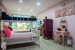 Postel nebo postele na pokoji v ubytování แอนฟาร์มรีสอร์ทแอนด์คาเฟ่