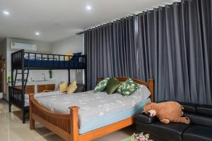 Postel nebo postele na pokoji v ubytování แอนฟาร์มรีสอร์ทแอนด์คาเฟ่