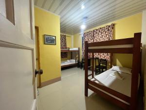 Postel nebo postele na pokoji v ubytování Portabaga Falls Park & Resort