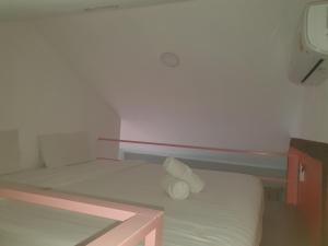 Postel nebo postele na pokoji v ubytování Momento Resort