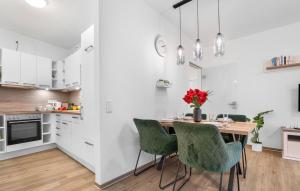 a kitchen and dining room with a table and chairs at Schleieck in Kappeln +31 photos