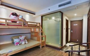Zhangjiajie Huan Sha Ju Hotel客房内的一张或多张床位