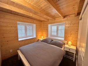 Posteľ alebo postele v izbe v ubytovaní Apartmány Hanička