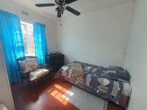 En eller flere senge i et værelse på Lifestyl Cottage