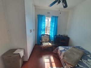 En eller flere senge i et værelse på Lifestyl Cottage