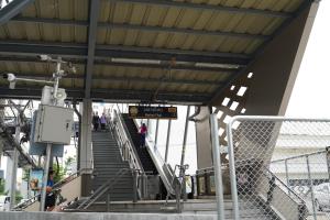 a stairway at a train station with people walking down it at ModernArt, walk10min MRT, 30airport in Bangkok
