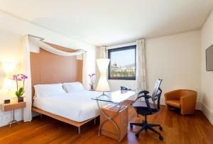 Postel nebo postele na pokoji v ubytování Hilton Garden Inn Florence Novoli