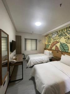 Postel nebo postele na pokoji v ubytování Maharlika City Inn + 18 fotografií
