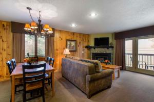 a living room with a table and a couch and a dining room at Bluegreen Vacations Blue Ridge Village, an Ascend Collection Resort in Banner Elk